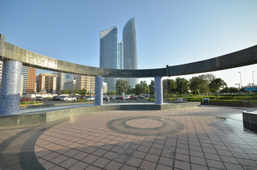 The fountain on the background of skyscrapers in Abu Dhabi, United Arab Emirates