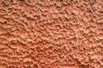 Grunge uneven red cement wall