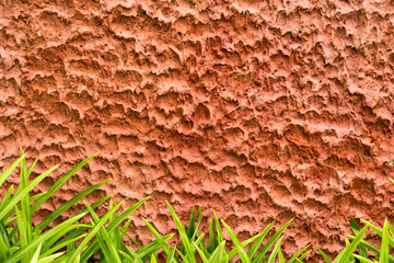 Grunge uneven red cement wall