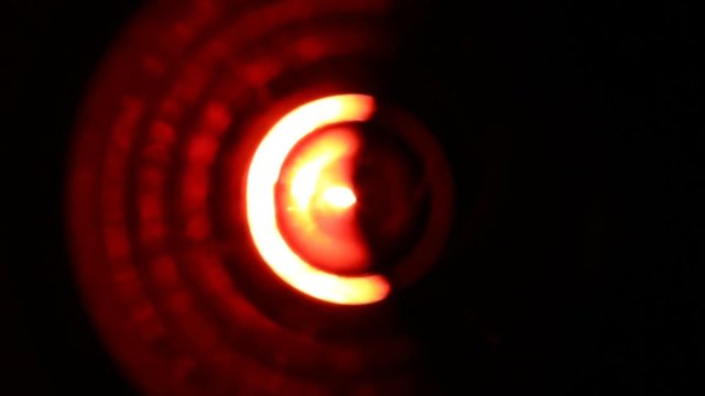 Extreme close-up of soft focused spinning red LED lights