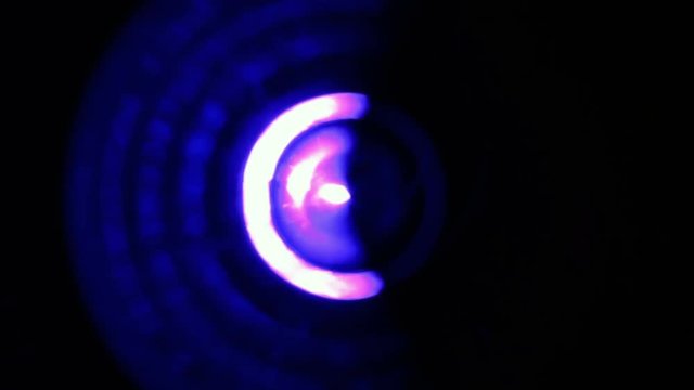 Extreme close-up of soft focused spinning blue LED lights