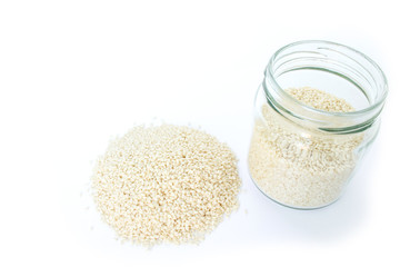 white sesame seed in jar on white background