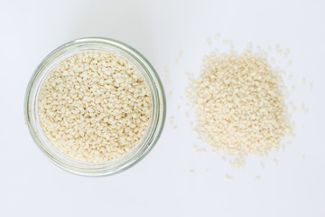 white sesame seed in jar on white background