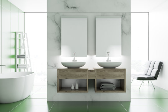 Double sink in marble and green bathroom