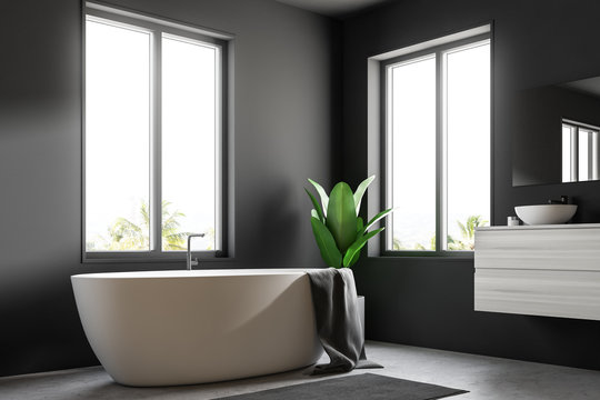White bathtub minimalistic gray bathroom corner