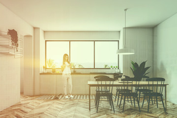 Fototapeta premium Tropic view kitchen interior, woman