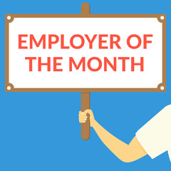 EMPLOYER OF THE MONTH. Hand holding wooden sign