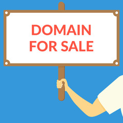 DOMAIN FOR SALE. Hand holding wooden sign