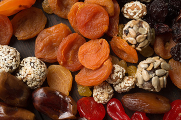 Dried fruits on wooden background