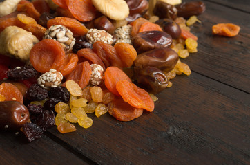 Dried fruits on wooden background