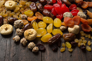 Dried fruits on wooden background