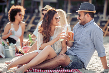 Portrait of happy young couple on the beach