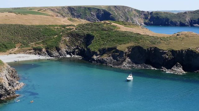 Looking down towards a white moter cruiser moored off Solva Pembrokeshire
