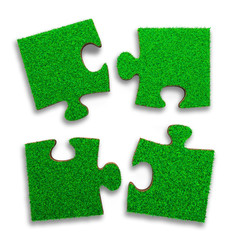 Four jigsaw puzzles of green grass texture, isolated on white, high angle view, 3D illustration.