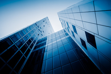 Modern office building against blue sky.