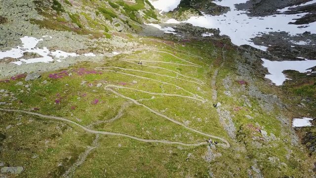 The hiking trail viewed from above with the drone. You can see a beautiful pattern on the mountains made by thousands of steps walked by hikers.