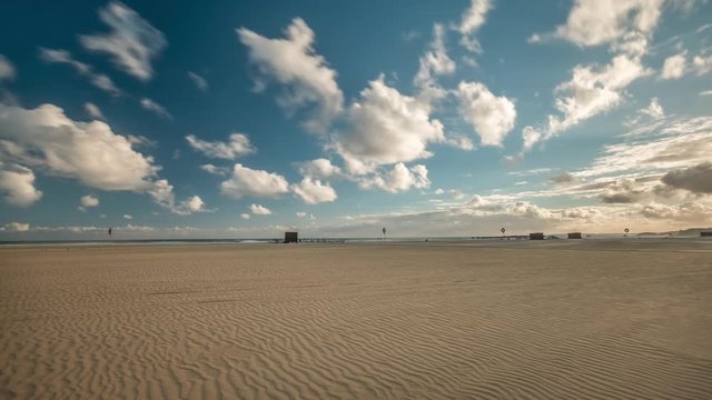 4K Timelapse of passing clouds over the empty beach of Portimao in the Algarve, Portugal.