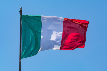 The red white and green Italian flag rippling in a breeze