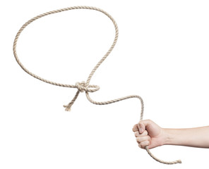 Male hand throwing a lasso, isolated on white background - obrazy, fototapety, plakaty