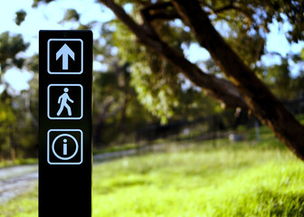 arrow walking information sign at park