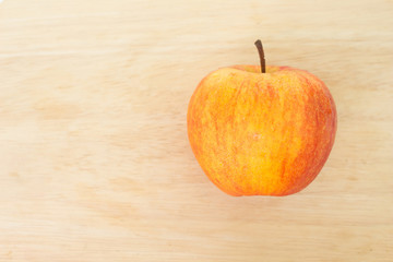 red apple top view on wooden background