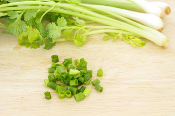 green onion and parsley vegetable ingredient food on cutting board
