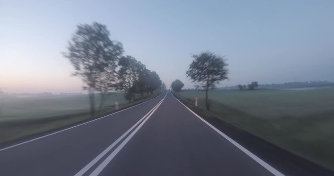 Fog on a rural road. POV car trip.