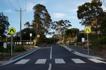 Fototapeta na wymiar Pedestrian crossing sign and zebra cross