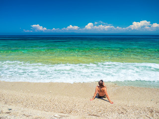 Fototapeta na wymiar woman sunbathing on the beach