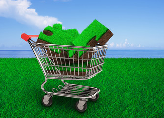 Big jigsaw puzzles made out of green grass and soil texture in the shopping cart, with meadow and...