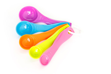 measuring spoons plastic on white background