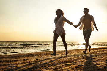 Fototapeta premium summer time on beach and two lovers 