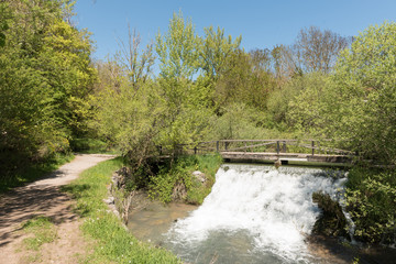 Fototapeta na wymiar Small waterfall near the source of the Ebro river in Fontibre