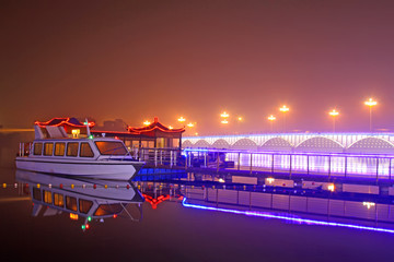 night landscape, bridge and cruise ship on the river