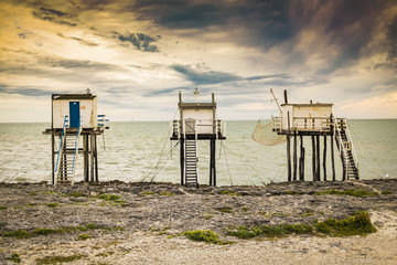 Three stilted fishing huts in Royan France