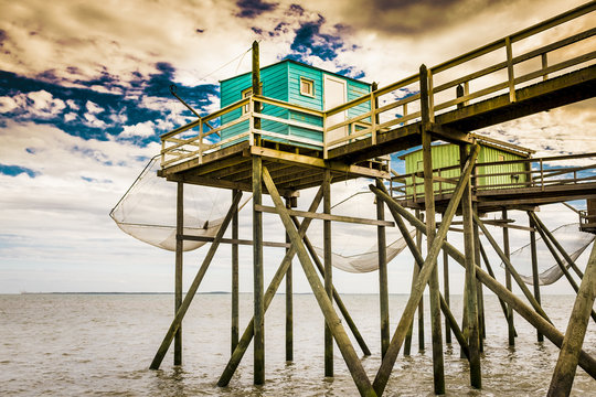 Wooden fishing huts on raised piers, Royan France