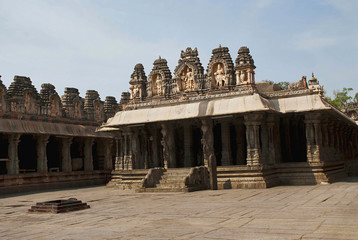 Fototapeta premium Pillared cloisters or prakara and the Ranga Mandapa, Virupaksha Temple, Hampi, karnataka. Sacred Center. View from the east.
