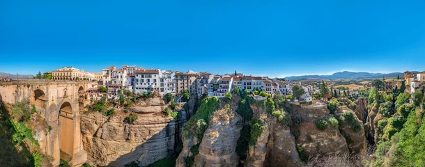 Wall murals Ronda Puente Nuevo Panorama view of the Puente Nuevo bridge and the houses built on the edge of the cliff, in the ancient city of Ronda, Spain
