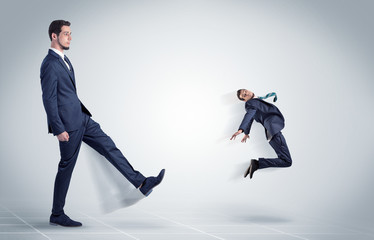 Young businessman fired cruel and aggressive by his boss with white background

