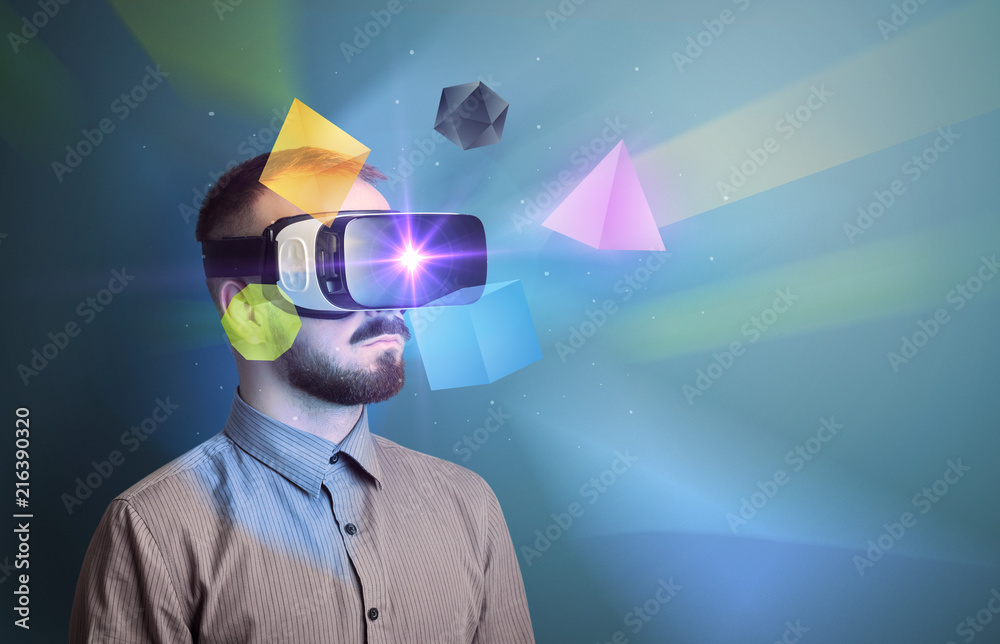 Poster amazed businessman with virtual reality colorful geometric shapes in front of him