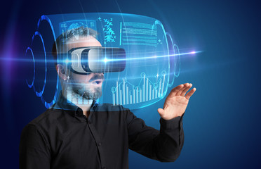 Amazed businessman with high tech 3D projection in front of him 