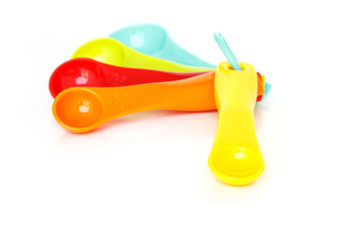 measuring spoons plastic on white background