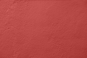 Concrete wall painted with a red paint
