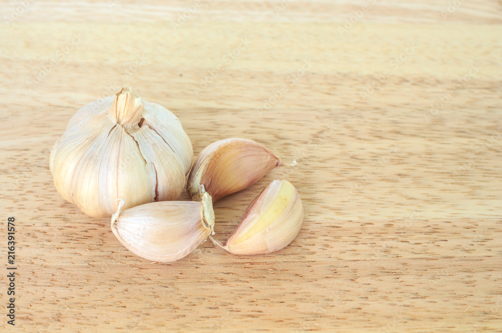 Wall mural garlic vegetable ingredient food top view on wood background