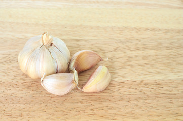 garlic vegetable ingredient food top view on wood background