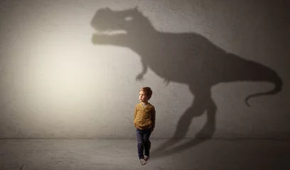 Photo sur Plexiglas Dinosaures I m dreaming about dinosaurus concept with cute little boy in an empty room  