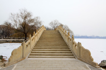 Fototapeta premium Ancient bridge in Old summer palace ruins park, Beijing, China