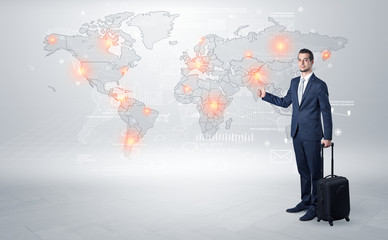 Businessman in dark suit hitchhike to business trip in a front of a map with destination