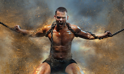 Muscular man slave in chains in a sand storm, the prisoner - obrazy, fototapety, plakaty