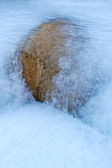 rocks in ice and snow